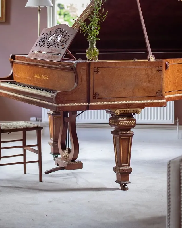 A grand piano in the piano room at Mountrothe House