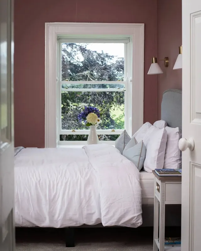 A king bedroom at Mountrothe House with a window onto the trees