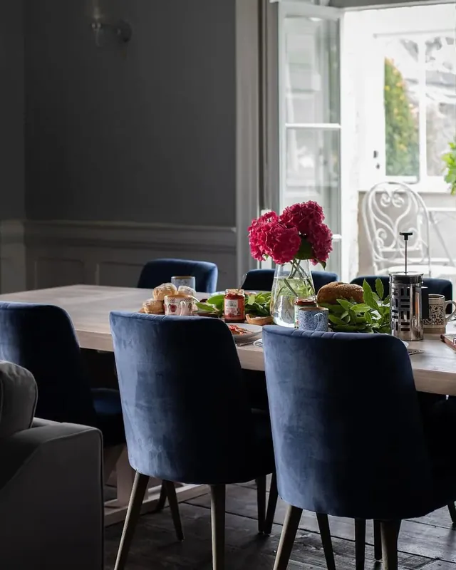 Breakfast laid on the long table in the dining room